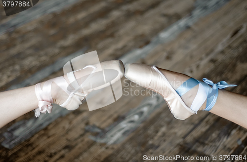 Image of Pointed feet in ballet shoes