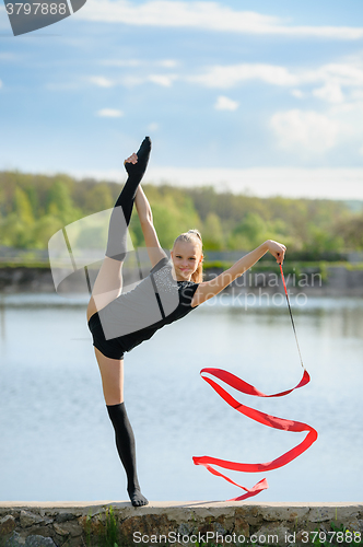 Image of Teen Gymnast Doing Vertical Split