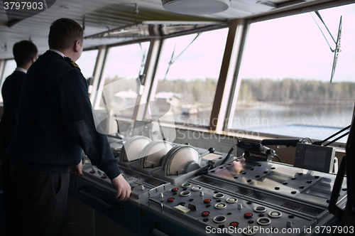 Image of Navigation officer driving cruise liner