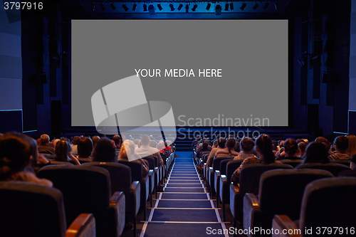 Image of Empty cinema screen with audience.