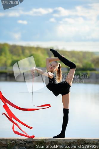 Image of Rhythmic Gymnast in Vertical Split with Ribbon