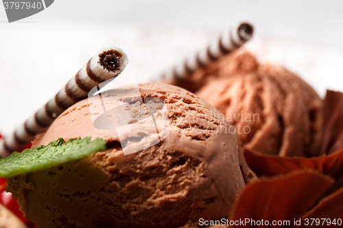 Image of Chocolate ice cream with striped wafer biscuits