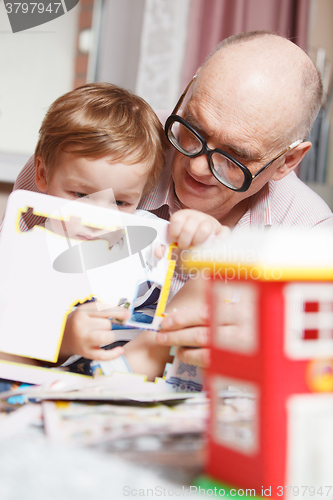 Image of Grandpa and his grandson playing