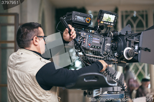 Image of Camera operator working during filming