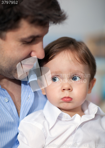 Image of Pout Boy on Father\'s Knees