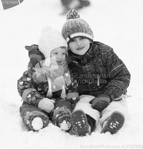 Image of group of kids having fun and play together in fresh snow
