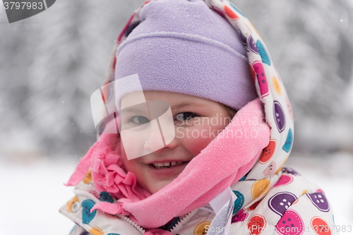 Image of little girl at snowy winter day