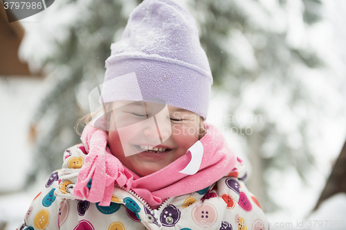 Image of little girl at snowy winter day