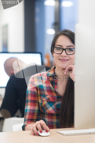 Image of startup business, woman  working on desktop computer