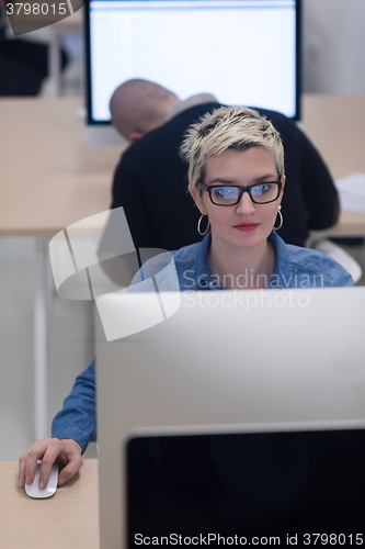 Image of startup business, woman  working on desktop computer