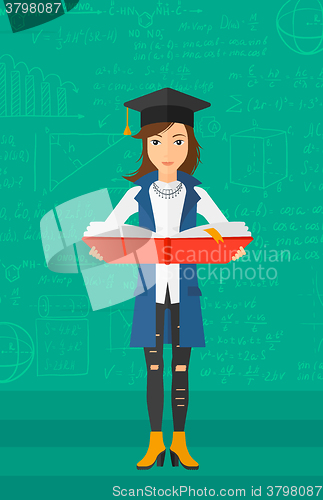 Image of Woman in graduation cap holding book.