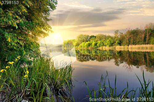 Image of Vibrant sunset on river