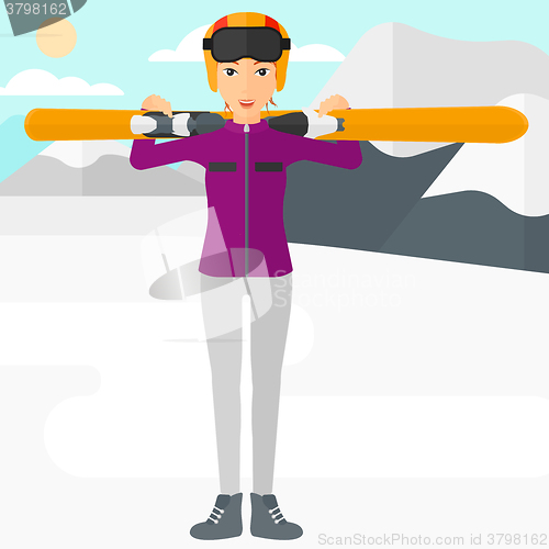 Image of Woman holding skis.