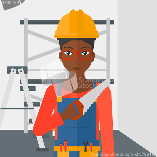 Image of Smiling worker with saw.