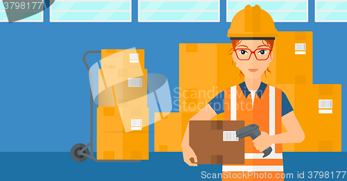 Image of Worker checking barcode on box.