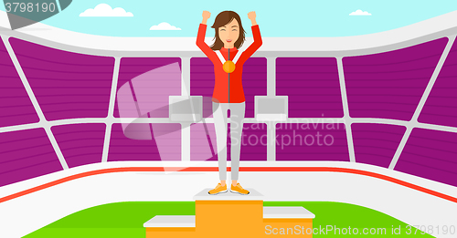 Image of Athlete with medal and hands raised.