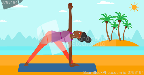 Image of Woman practicing yoga.