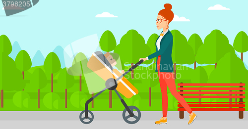 Image of Woman pushing pram.