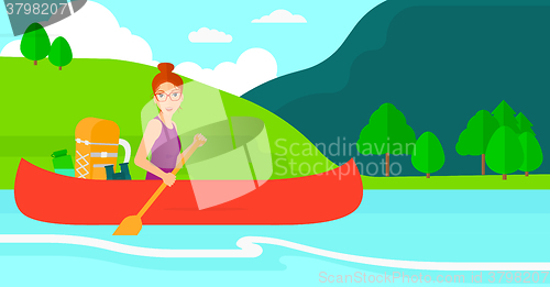 Image of Woman canoeing on the river.