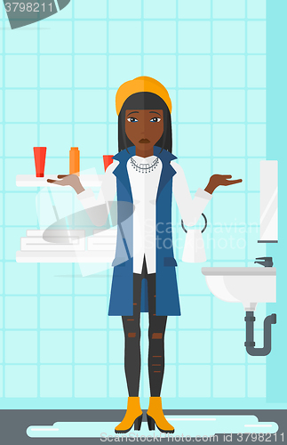 Image of Woman in despair standing near leaking sink.