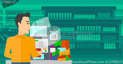 Image of Cashier at supermarket checkout.