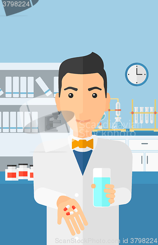 Image of Pharmacist giving pills.