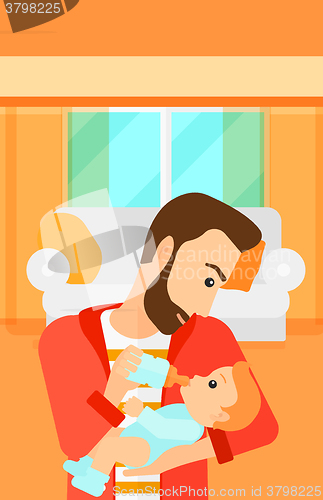 Image of Man feeding baby.