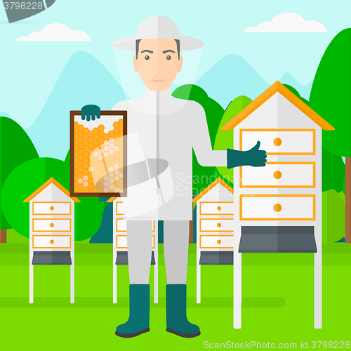 Image of Bee-keeper at apiary.