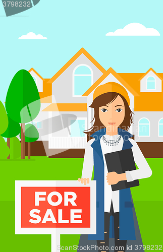 Image of Real estate agent offering house.