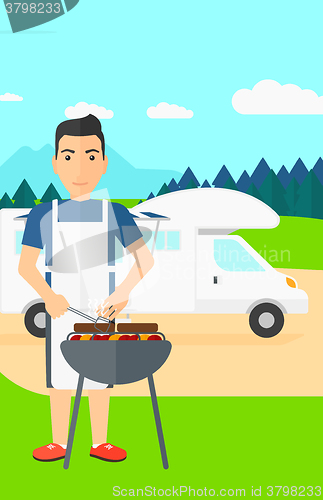 Image of Man preparing barbecue.