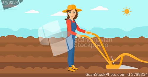 Image of Farmer on the field with plough.