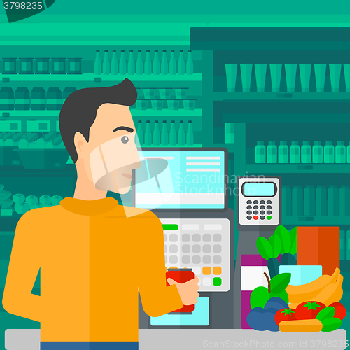 Image of Cashier at supermarket checkout.