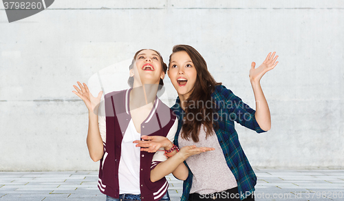 Image of happy smiling pretty teenage girls having fun