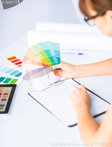 Image of woman working with color samples for selection