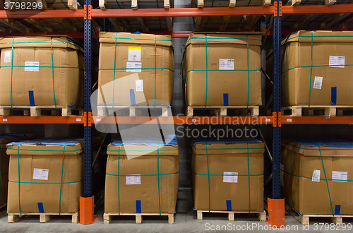 Image of cargo boxes storing at warehouse shelves