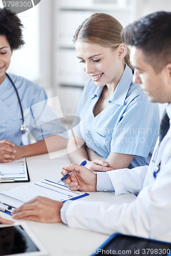 Image of group of happy doctors meeting at hospital office