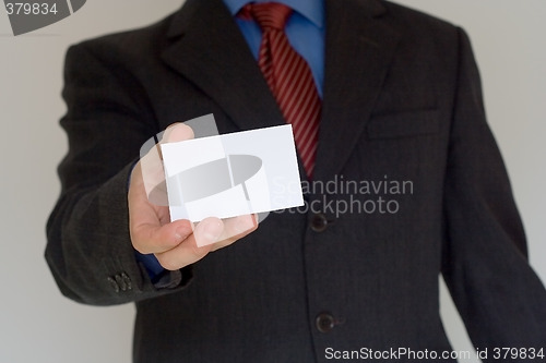Image of Bussiness man ofering his card