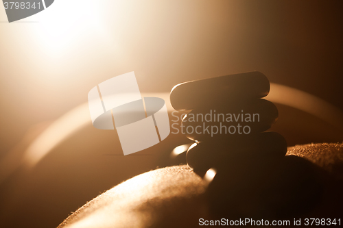 Image of Girl taking hot stone treatments at beauty spa