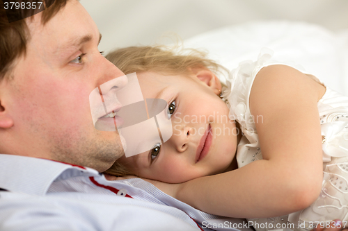 Image of Lovely girl close to beloved father