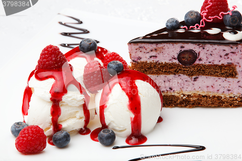 Image of Vanilla icecream with berry coulis and fresh fruit