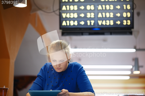 Image of Woman with touchpad in the waiting room