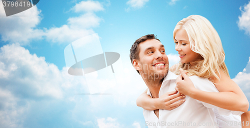 Image of happy couple over blue sky