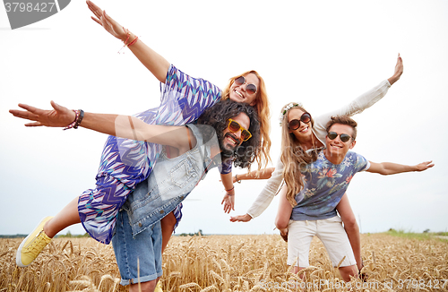 Image of happy hippie friends having fun on cereal field
