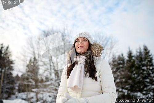 Image of happy woman outdoors in winter