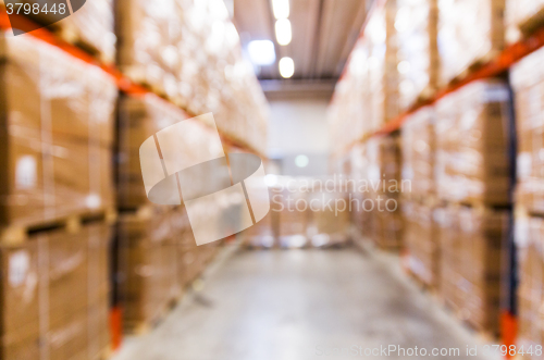 Image of cargo boxes storing at warehouse shelves bokeh