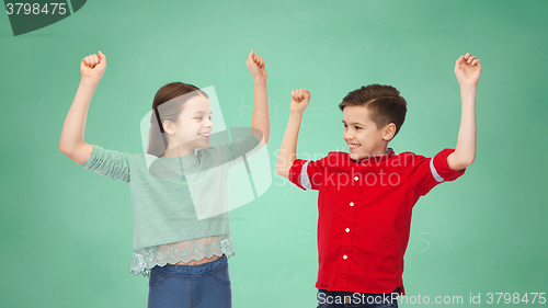 Image of happy boy and girl celebrating victory