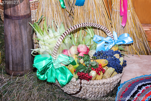 Image of Fruits and vegetables in wicker basket sold at the fair.