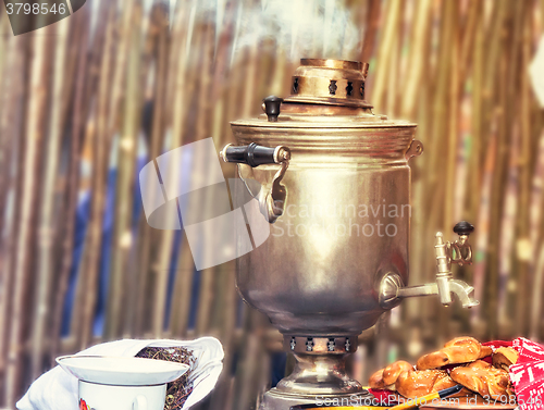 Image of Boiling tea from the old samovar.