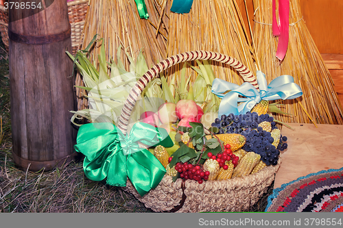 Image of Fruits and vegetables in wicker basket sold at the fair.