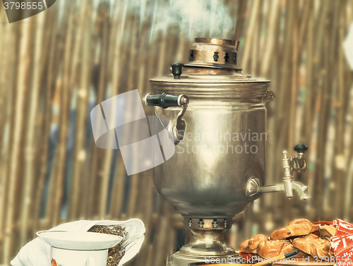 Image of Boiling tea from the old samovar.